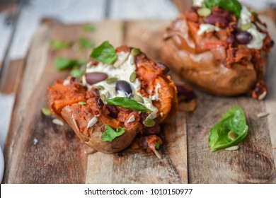 Sweet Potato Jacket Potato Filled With Chilli Con Carne And Sour Cream