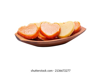 Sweet Potato Jam and Pumpkin Jam in the shape of a Pumpkin Heart. Typical sweet of the Festa Junina. Brazilian traditional food in a wooden bowl isolated on white background. Sweets from the June Fest