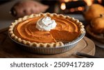 Sweet Potato Pie:
Smooth, spiced sweet potato filling in a flaky crust, a Southern dessert topped with whipped cream.