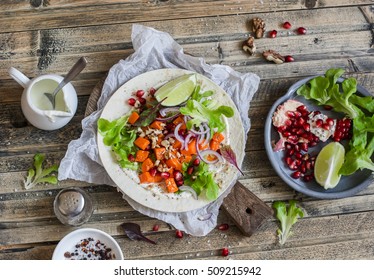 Sweet Potato Wrap. Delicious Vegetarian Snack. On A Wooden Rustic Table, Top View.