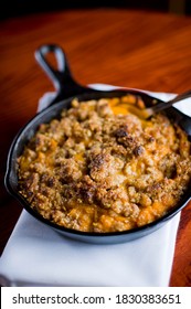 Sweet Potatoes Or Candied Yams. Classic American Thanksgiving Side Dish. Served With Toasted Marshmallows, Cheese, Garnished With Scallions And Italian Parsley And Served In Cast Iron Skillet. 