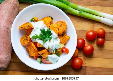 Sweet potatoes with a mexican flavor of cherry tomatoes, corn, onion and cucumber