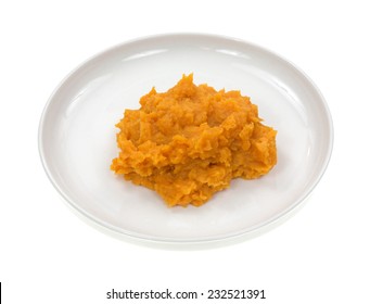 Sweet potatoes on a small plate atop a white background.