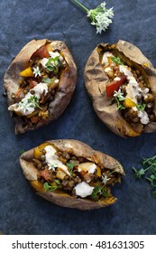 Sweet Potatoes With Spicy Lentils, Yellow Pepper And Tomato Filling, Thyme, Garlic Flowers And Chipotle Sour Cream