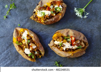 Sweet Potatoes With Spicy Lentils, Yellow Pepper And Tomato Filling, Thyme, Garlic Flowers And Chipotle Sour Cream