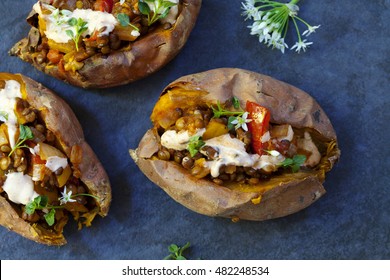 Sweet Potatoes With Spicy Lentils, Yellow Pepper And Tomato Filling, Thyme, Garlic Flowers And Chipotle Sour Cream