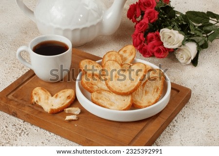 Sweet puff pastry,palmier cookies with cup of coffee