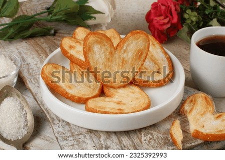 Sweet puff pastry,palmier cookies with cup of coffee