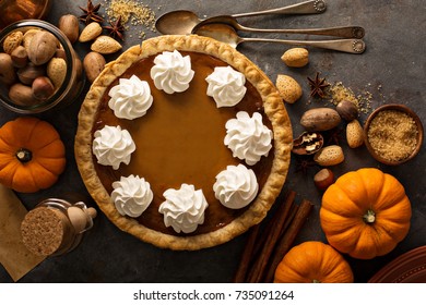 Sweet Pumpkin Pie Decorated With Whipped Cream Overhead Shot With Copy Space