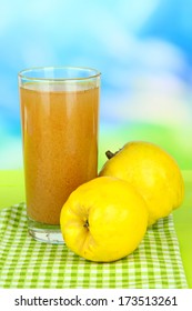 Sweet Quince With Juice On Table On Light Blue Background