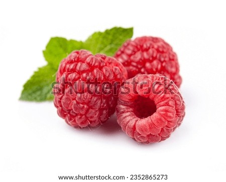 Sweet raspberry with leaves closeup onwhite backgrounds.
