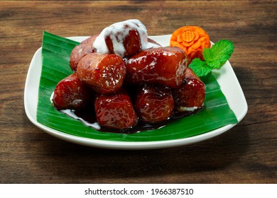 Sweet Red Banana in Syrup with Coconut Milk decorate Carved Carrot Flower sideview