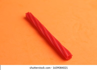 sweet red licorice in color background