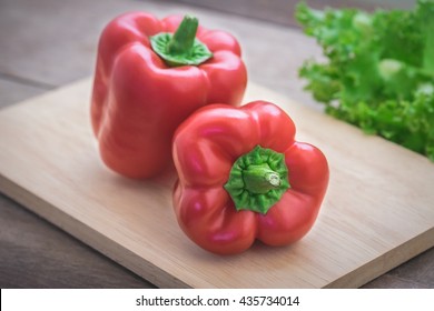 Sweet Red Pepper On Wooden Cutting Board