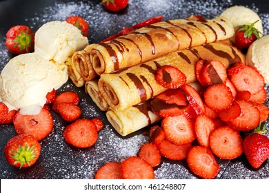 Sweet Rolled Pancakes With Nutella, Strawberry And Ice Cream.