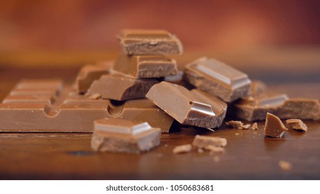 Sweet And Salty Chocolate Snacks, Salted Caramel Bar, Macro Close Up On Rustic Wood Background.