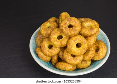 Sweet And Salty Snack - Corn Puff Donuts With Peanuts And Caramel In A Bowl