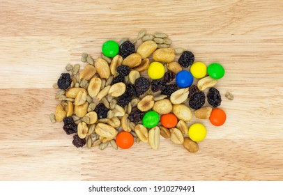 Sweet And Salty Trail Mix Portion On A Wood Countertop Overhead View.