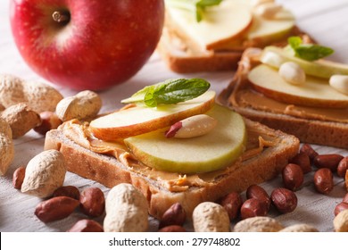 Sweet Sandwich With Peanut Butter And Apple Close Up. Horizontal 