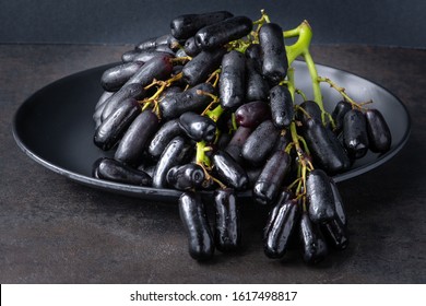 Sweet Sapphire Grapes grown in California are a new exciting variety that is crisp and has an unusual long shape like a finger. - Shutterstock ID 1617498817