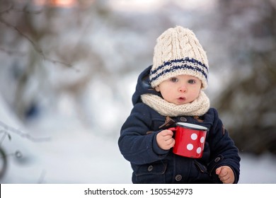 Sweet Siblings, Children Having Winter Party In Snowy Forest. Kids Friends Rest Outdoor At Nature. Young Brothers, Boys, Drinking Tea From Thermos. Hot Drinks And Beverage In Cold Weather