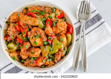 Sweet And Sour Chicken In A Bowl With Rice Directly From Above Photo. Popular American Chinese Food, American Chinese 
Cuisine, Food Photography.