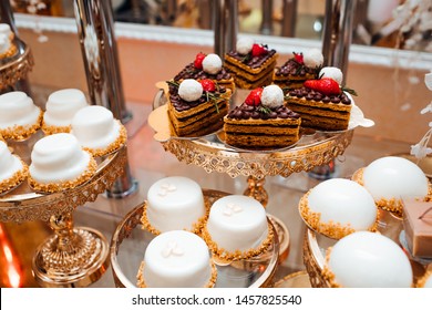 Sweet Table For Birthday Or Wedding. Candy Bar With A Lot Of Desserts, Meringue, Cupcake, Fruit And Sweet Cakes. 