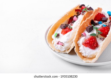 Sweet Tacos With Thin Waffle, Cottage Cheese Cream And Strawberry Topped With Chocolate And Mint. Dessert Variation Of Mexican Classics. Copy Space