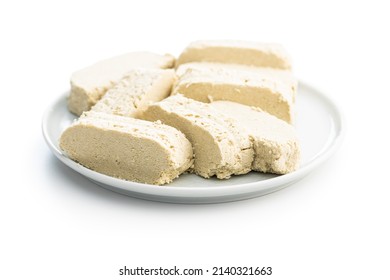 Sweet Tahini Halva On Plate. Turkish Dessert Isolated On A White Background.