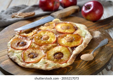 Sweet Tarte Flambée from Alsace with apple rings and candeed cinnamon sugar as a dessert hot from the oven