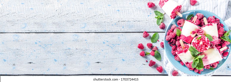 Sweet And Tasty Diet Summer Dessert. Homemade Raspberry Yogurt Popsicle With Fresh Raspberries And Mint. Healthy Ice Cream Recipe. Wooden White Background Copy Space