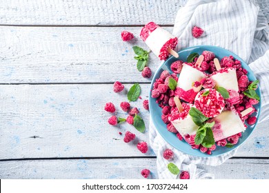 Sweet And Tasty Diet Summer Dessert. Homemade Raspberry Yogurt Popsicle With Fresh Raspberries And Mint. Healthy Ice Cream Recipe. Wooden White Background Copy Space