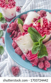 Sweet And Tasty Diet Summer Dessert. Homemade Raspberry Yogurt Popsicle With Fresh Raspberries And Mint. Healthy Ice Cream Recipe. Wooden White Background Copy Space