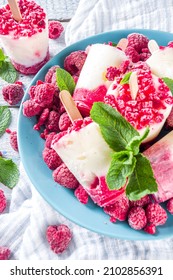 Sweet And Tasty Diet Summer Dessert. Homemade Raspberry Yogurt Popsicle With Fresh Raspberries And Mint. Healthy Ice Cream Recipe. Wooden White Background Copy Space