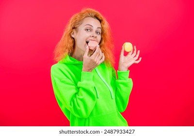 Sweet tooth. Yummy. Woman with yummy cookie. Woman with macaron dessert isolated on pink. Woman hold French macaron. Macaroon cookie. Confectionery. Sweet French macaroon. Macaron bakery - Powered by Shutterstock