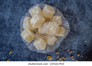 Sweet Turkish delight covered with coconut in a white glass plate . - Shutterstock ID 2191617925