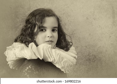 Sweet Victorian Girl Posing In The Old Style With A Ruff Collar