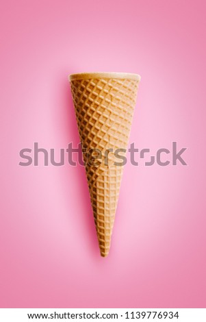 Similar – Ice cream cone with unpeeled peanuts on pink background