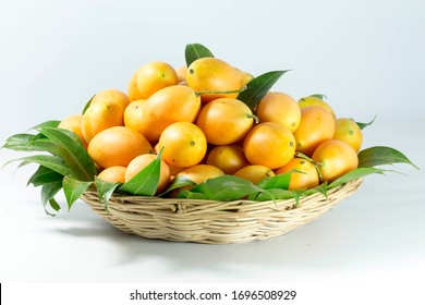 sweet yellow Marian plum thai fruit in basket background (Mayongchid Maprang Marian Plum and Plum Mango,Thailand)