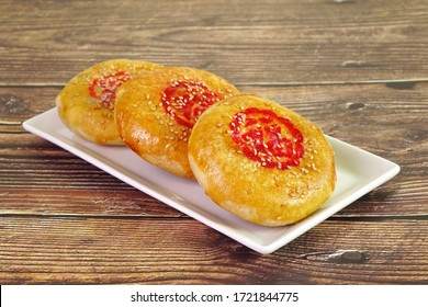 A sweetheart cake (Lao Po Bing) or wife cake or marriage pie is a traditional Cantonese pastry with a thin crust of flaky pastry. (Red Chinese word “Fu” on cake mean “Happiness”) Selective focus