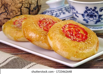 A sweetheart cake (Lao Po Bing) or wife cake or marriage pie is a traditional Cantonese pastry with a thin crust of flaky pastry. (Red Chinese word “Fu” on cake mean “Happiness”)