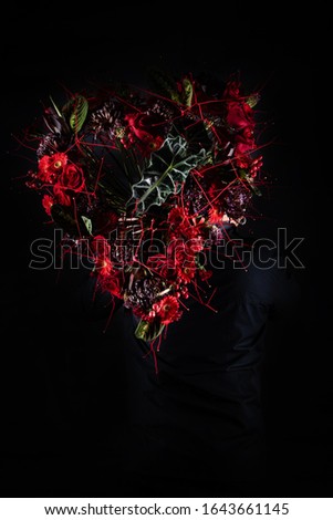 Similar – a girl with blue eyes and long hair covering herself with a gerbera flower