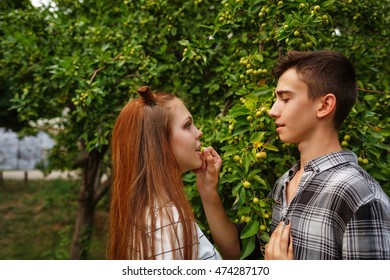 Sweethearts Teens Together. Girlfriend And Boyfriend Together. The Boy Feeds Wild Apple Woman. First Love. He Falls In Love. Date.