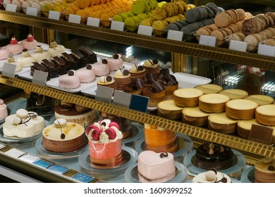 Sweets And Cakes On Display In Bakery Shop