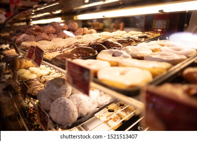 Sweets And Donuts In A Display Case