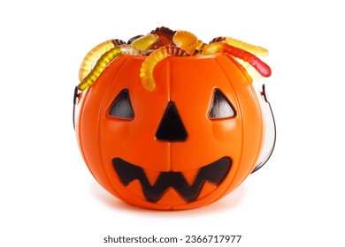 Sweets gummy worms candies in Halloween bag basket jack o lantern pumpkin isolated on white background - Powered by Shutterstock