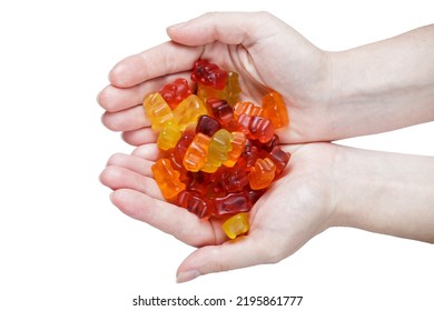 caramelos en manos de una chica aislada en blanco. dulces de gelatina. Las gelatinas de fruta tienen diferentes sabores y colores. vista superior. espacio de copia