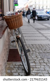 Swiebodziec, Poland - December 2019 : Newspaper In A Bicycle Basket Parked By A Old Tenemet House Wall In Świebodzice, Poland