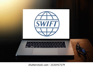 SWIFT logo on laptop screen.