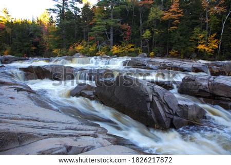 Swift River cascades in New Hampshire's Rocky Gorge scenic area – popular tourist destination in the White Mountains in summer and fall
